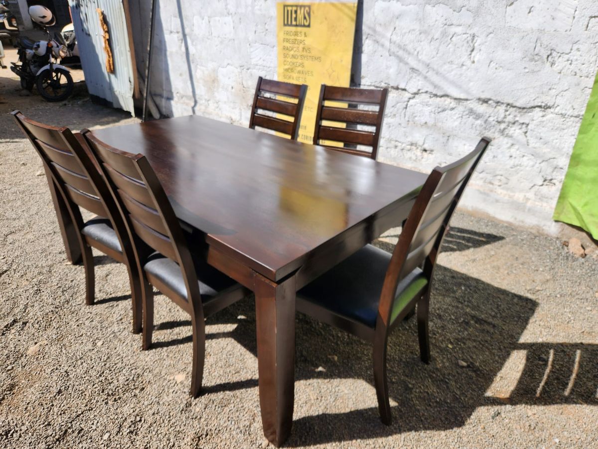 A premium 5 Seater Contemporary Wooden Dining Set